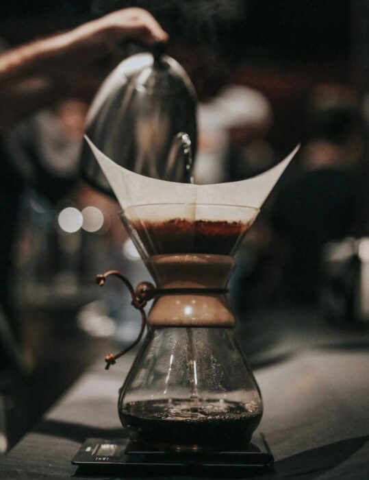 Image of water being carefully poured into coffee percolator - Navarro Creative Group pours into businesses with unmatched services boosting brand recognition, establishing brands as an industry authority with tailored website design strategic digital marketing.